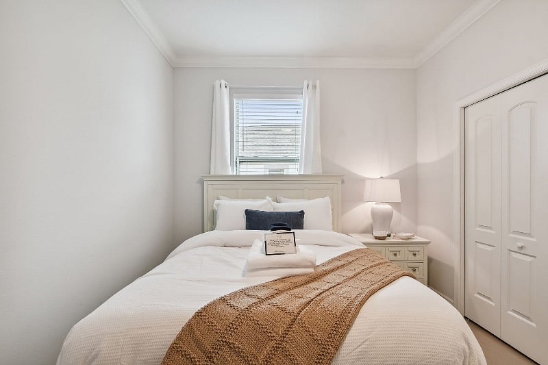 Guest bedroom 3 with queen sized bed. Workspace table/chair available in this room. 