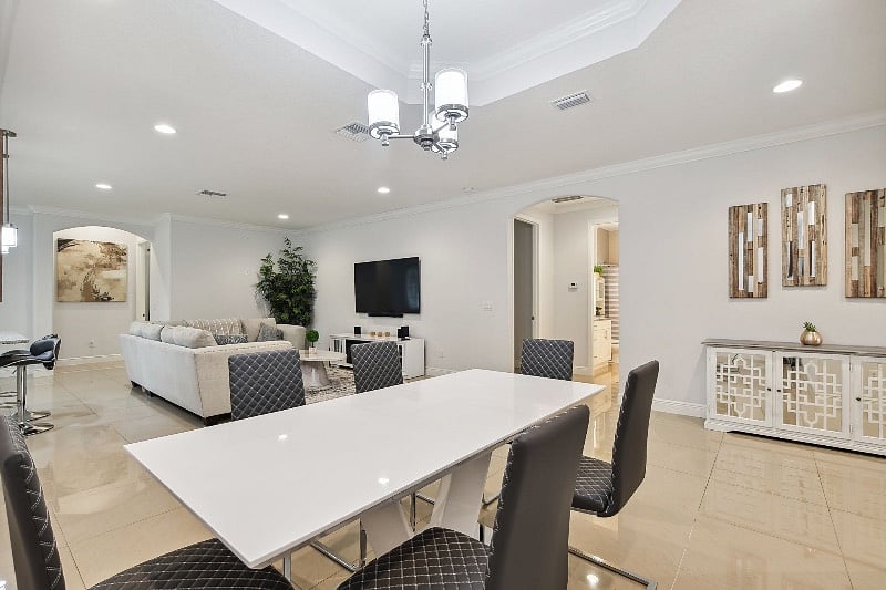 Dining Room table accommodates 6 people. Additional seating at the circle table for 4 people near the back doors. Baby seat is available as well
