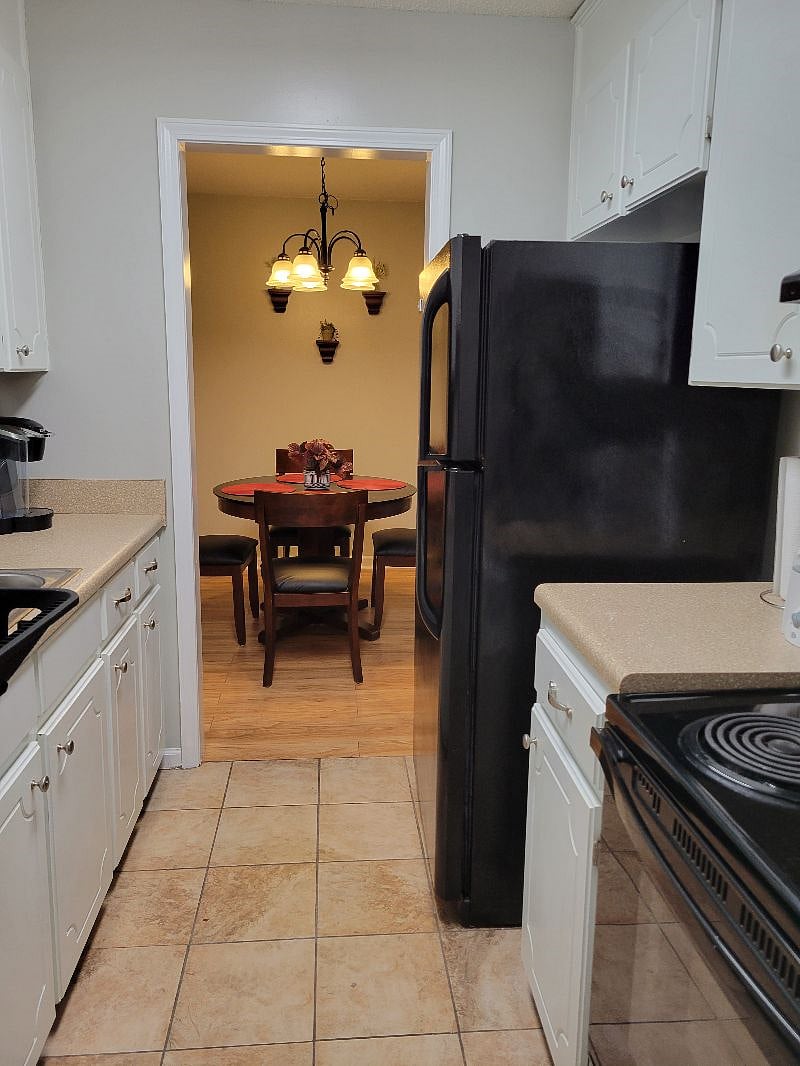 Northside Condo. From kitchen facing dining room.