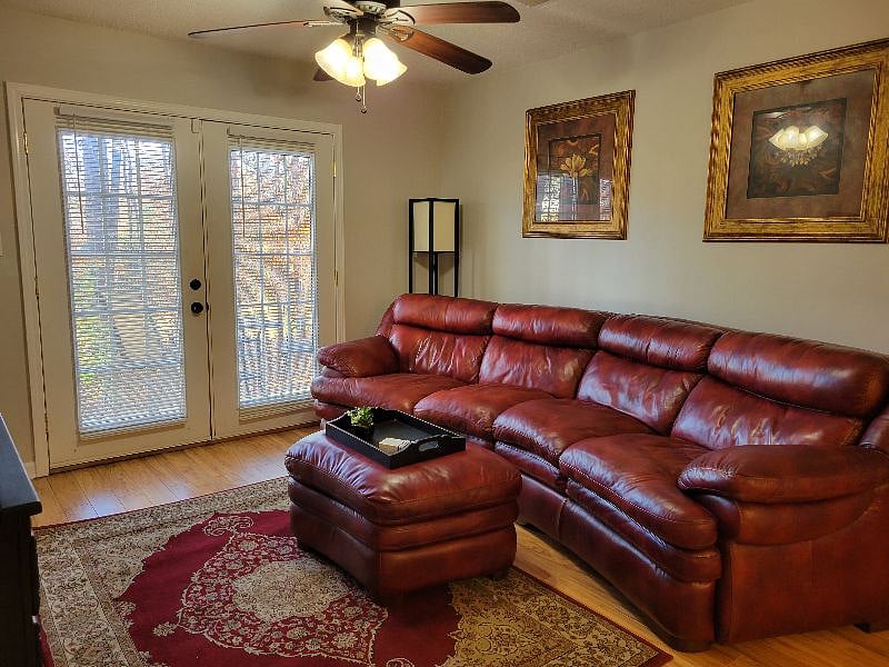 Northside Condo. Living Room with doors to patio.