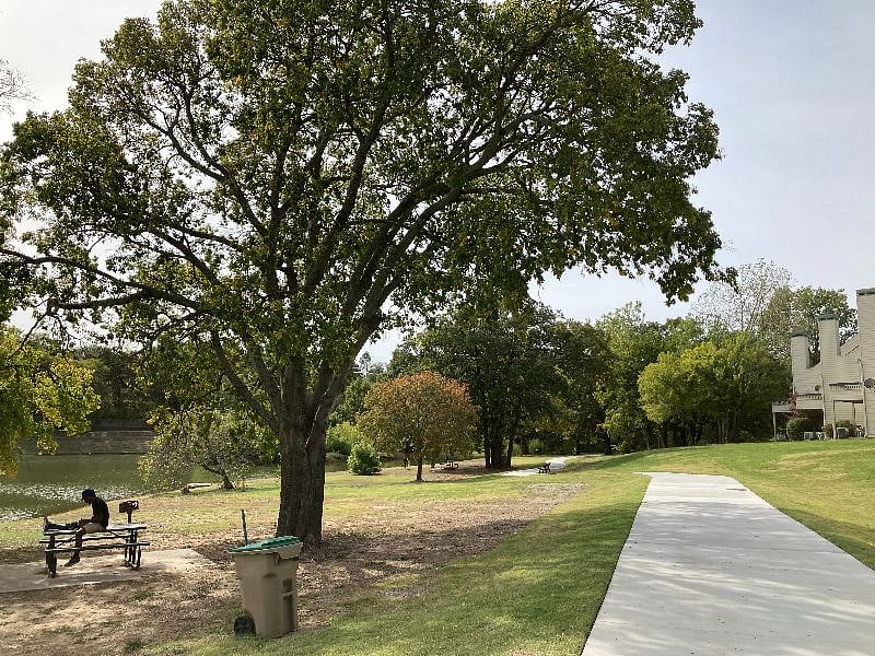 Walking trail around a large pond directly outside of Tenant Suite & patio