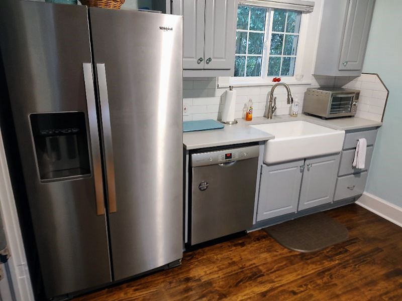 Refrigerator with filtered water/ice, Bosch dishwasher, air-fryer / toaster oven, farm house sink, garbage disposal, quartz counter tops.