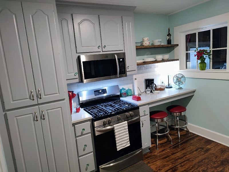 gas stove. bar seating.