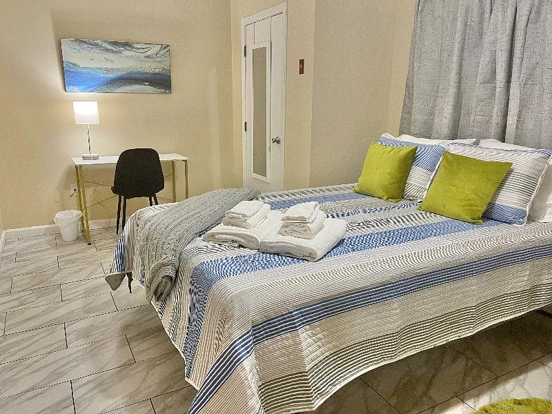 Queen size bed with workspace, closets and dresser storage