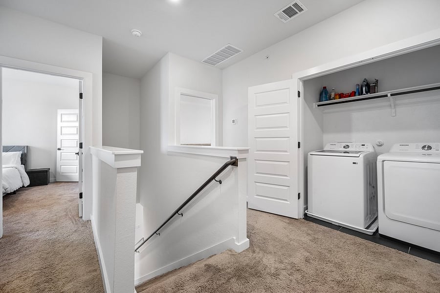 Washer and dryer right off bedrooms