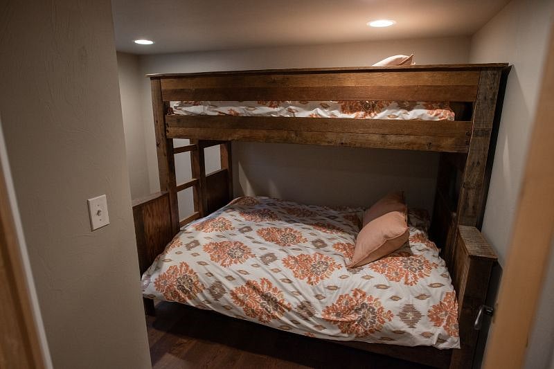 Queen bed with twin bed overhead.