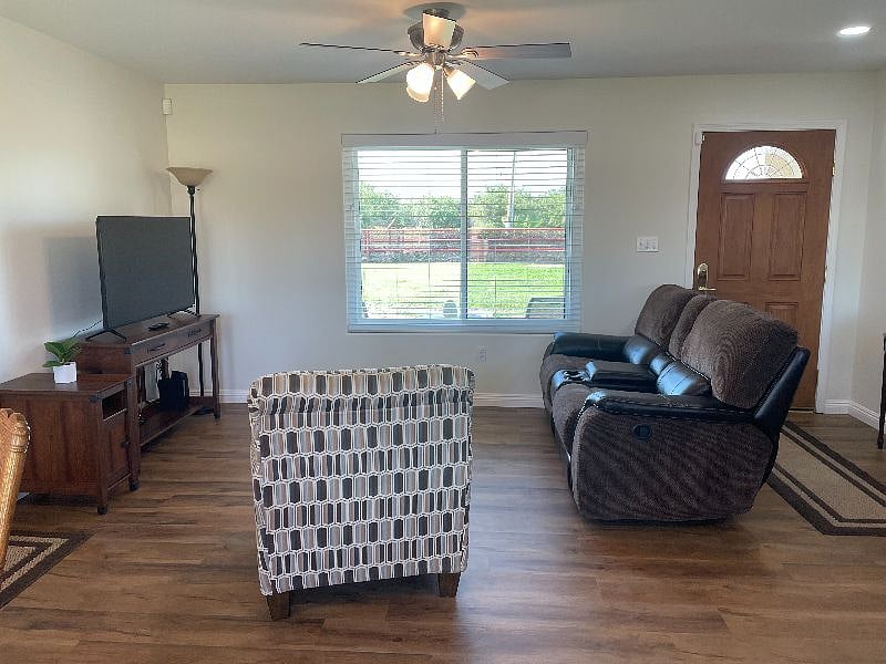 Living Room with Recliners in Loveseat