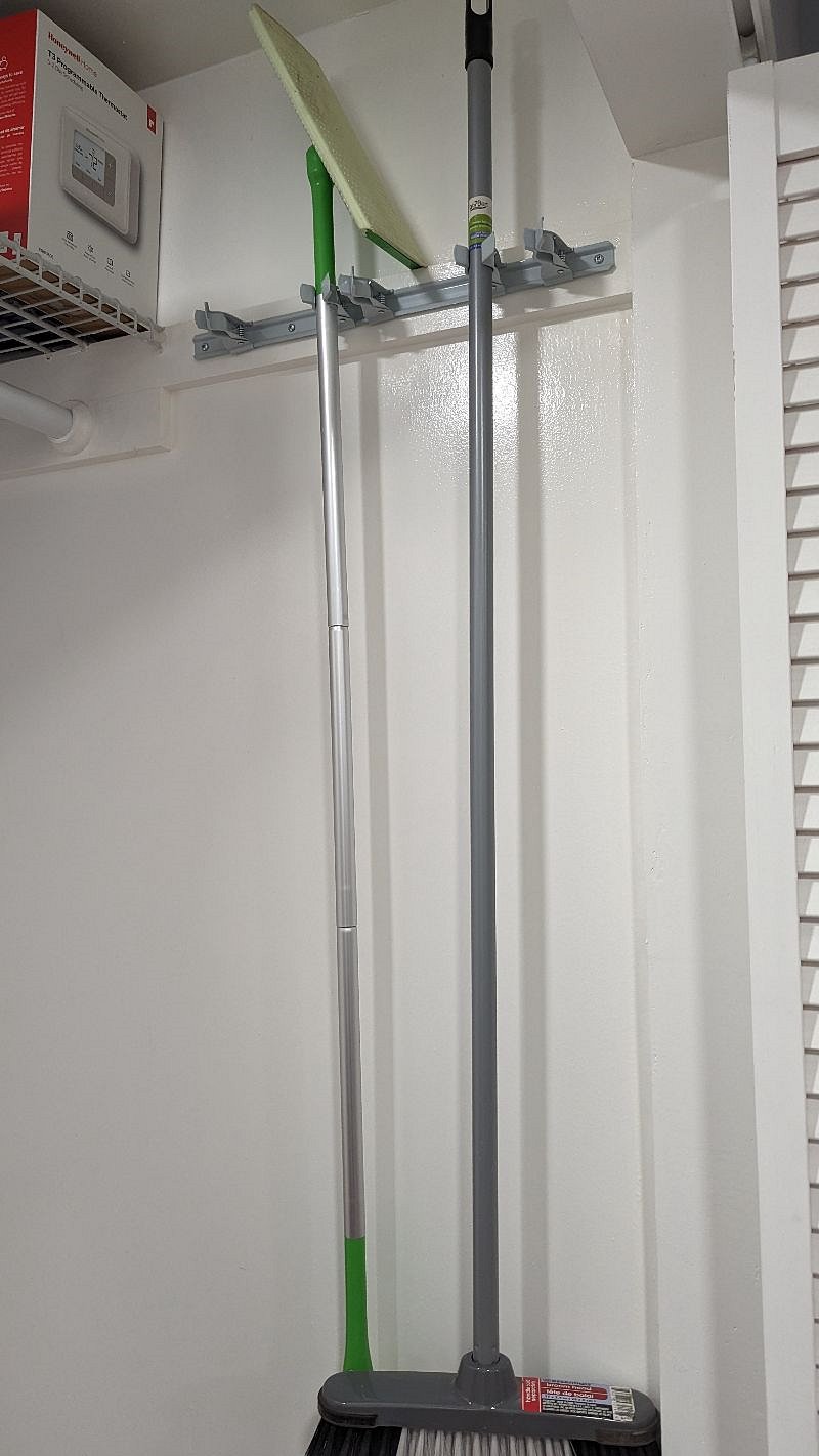 cleaning supplies in the front closet by entry door