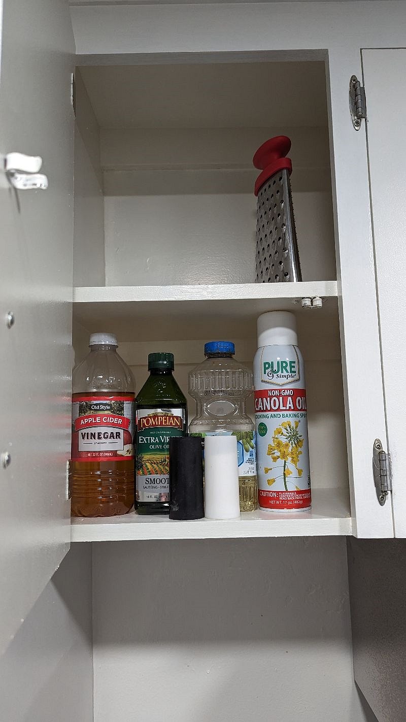 Cooking supplies above to left of stove