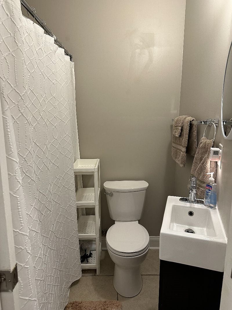Second bathroom with full shower located in hallway