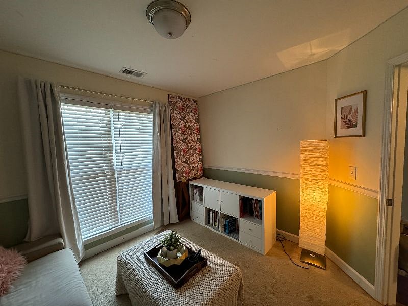 Bedroom 2 - currently a multi-purpose room - guest room (the 3.5 seat sofa pulls out to a bed), craft space with flip up table, and theatre room.