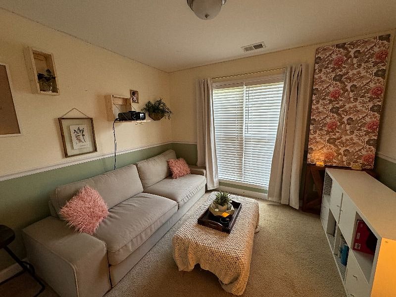 Bedroom 2 - currently a multi-purpose room - guest room (the 3.5 seat sofa pulls out to a bed), craft space with flip up table, and theatre room.