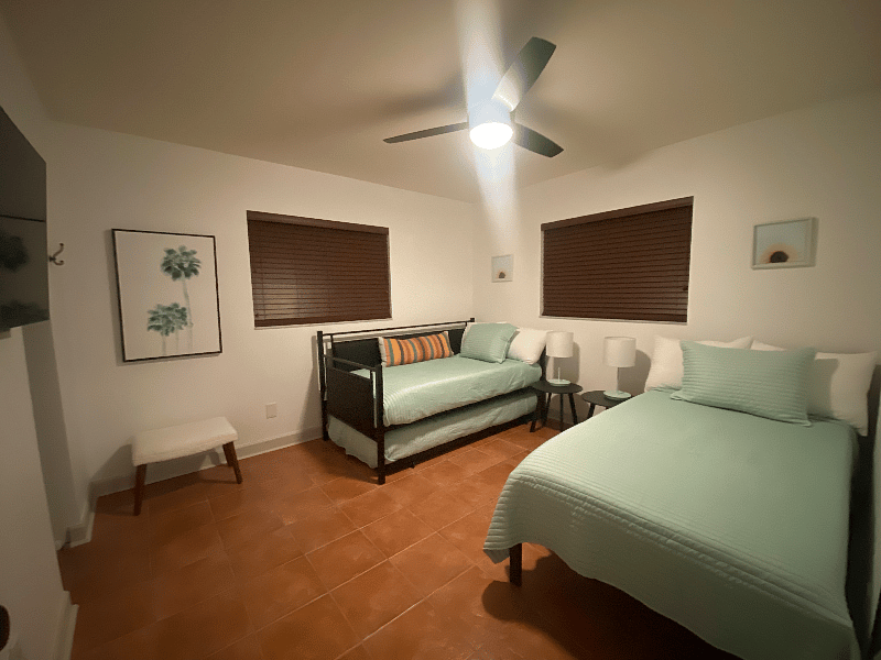 4th bedroom with twin and twin trundel beds and flat screen tv