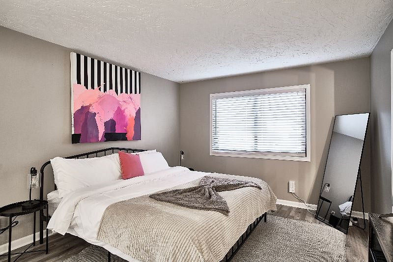 Main Level Master bedroom with king bed, work station, usb bedside laps and smart TV