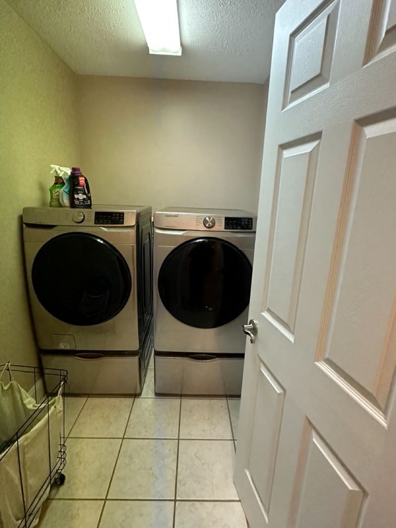 In unit washer and dryer upstairs between bedrooms. 