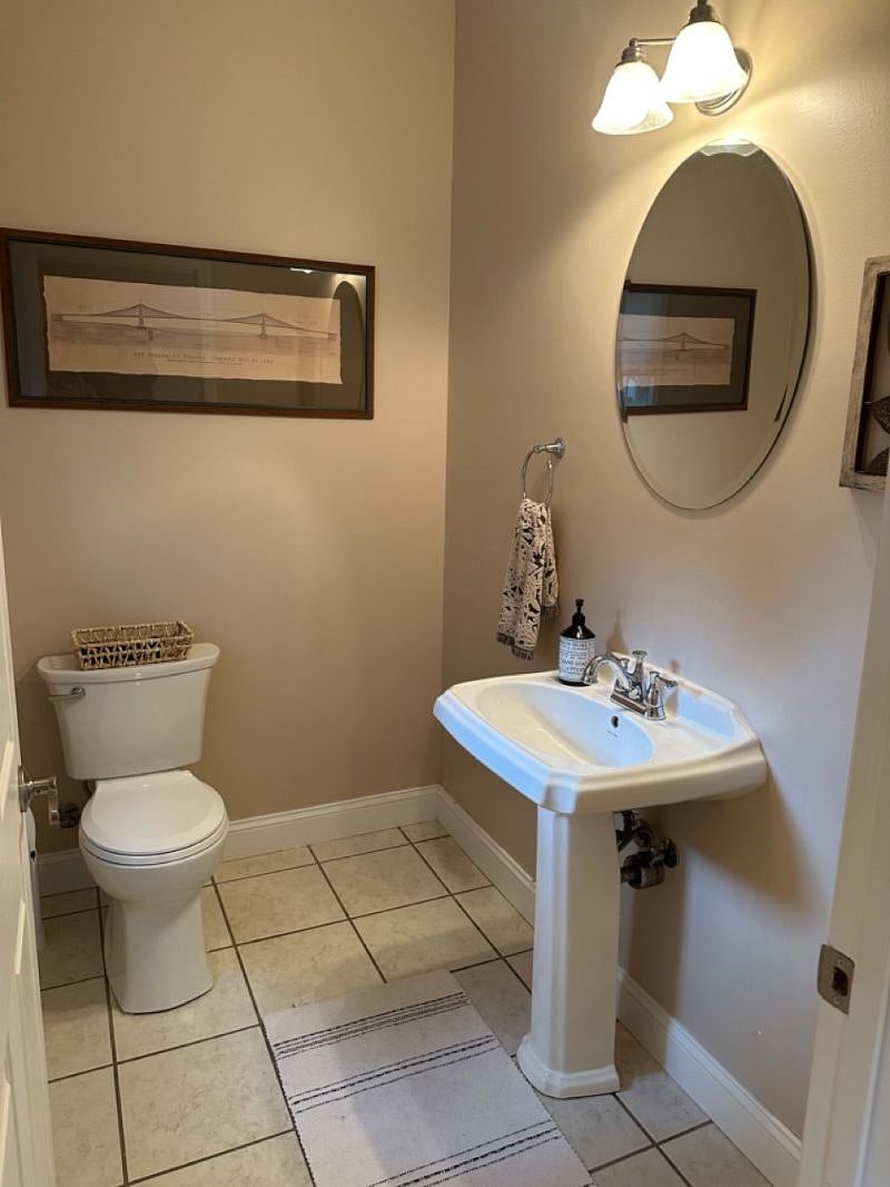 Half-bathroom on first floor next to front door. 