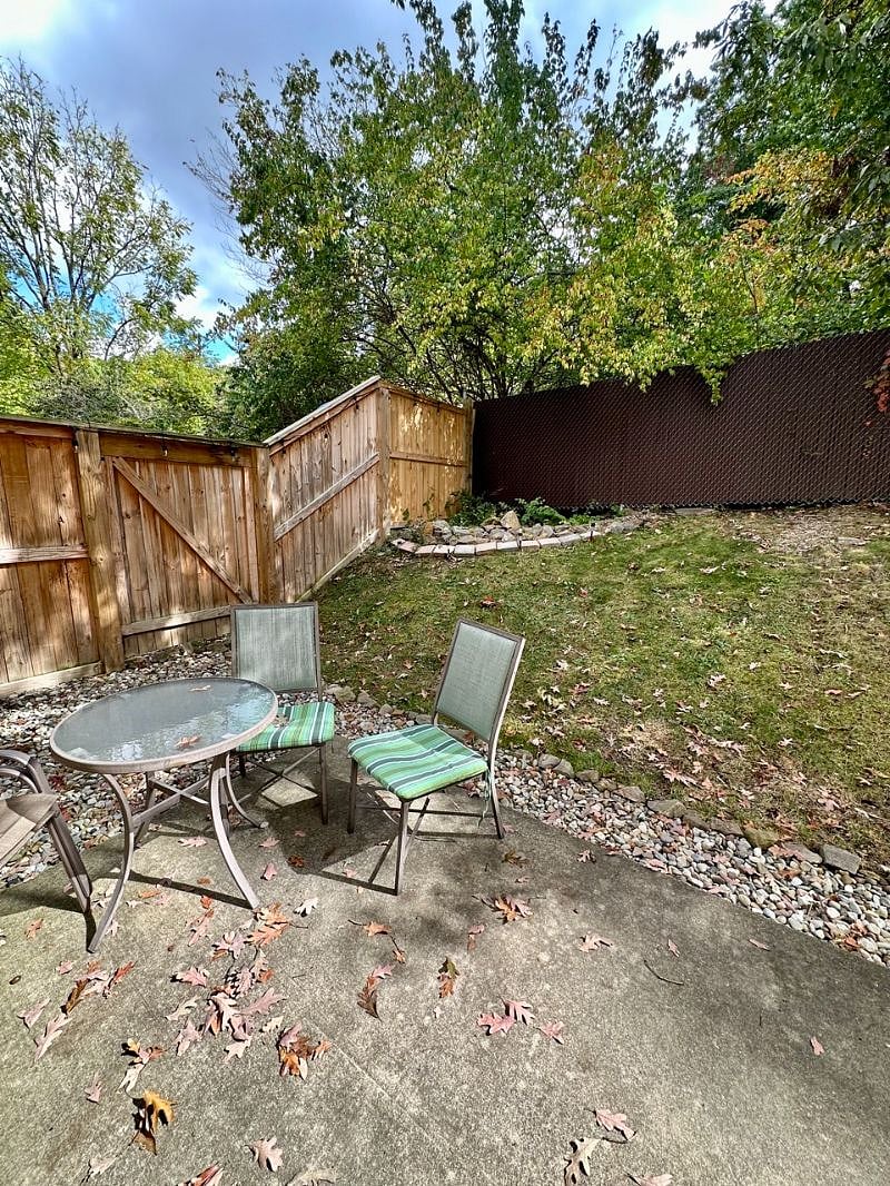 Private backyard with newly finished rock garden with french drain.