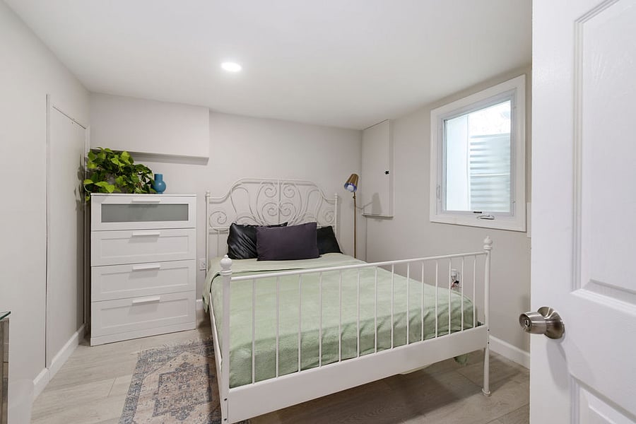 Primary bedroom in basement. Fits queen size bed