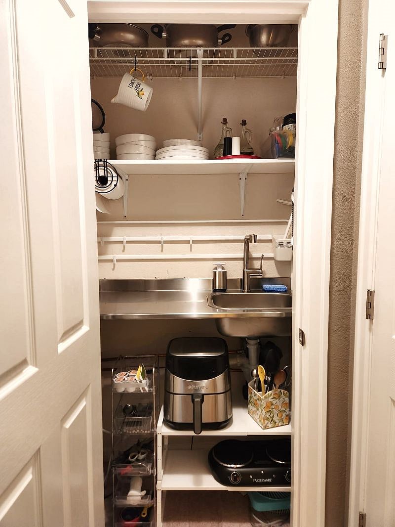 Kitchenette with 2 burner stove, air fryer, sink and stocked with all necessary supplies