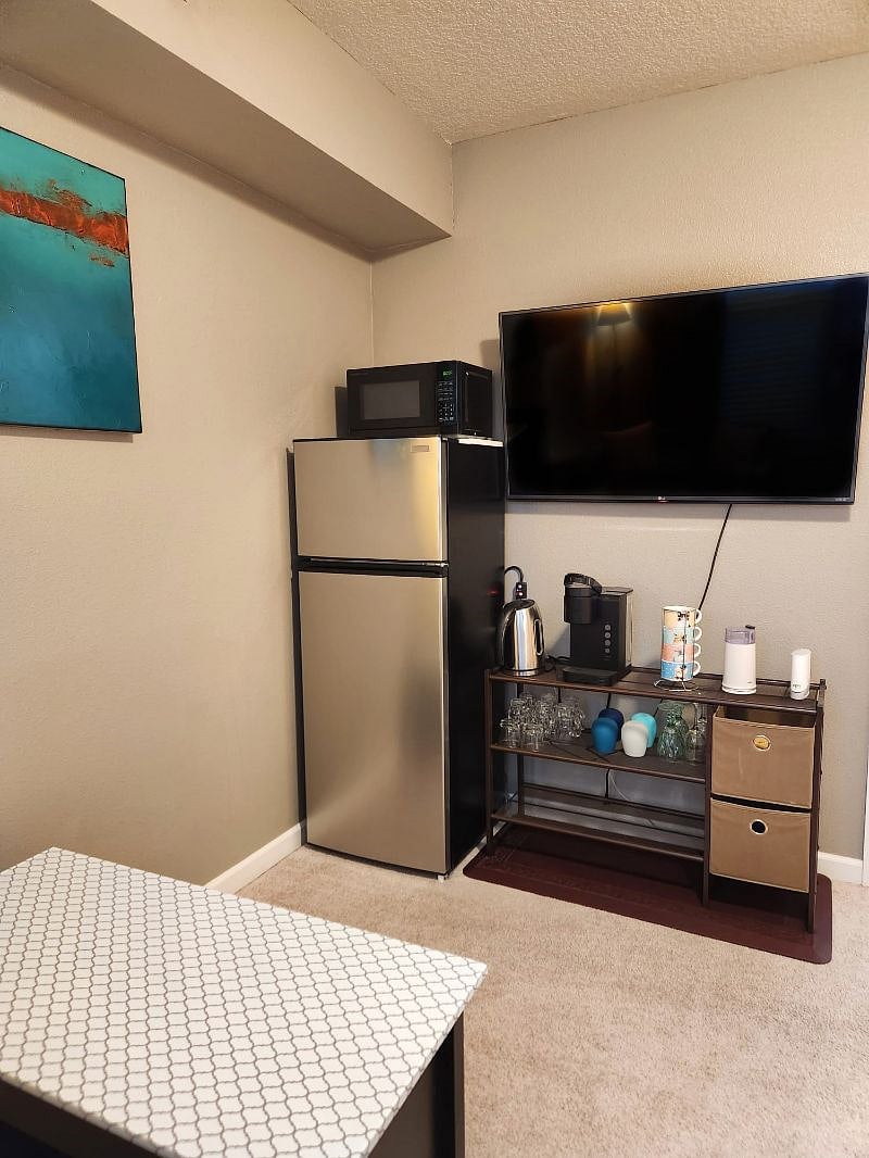 Apartment sized refrigerator with coffee/tea station