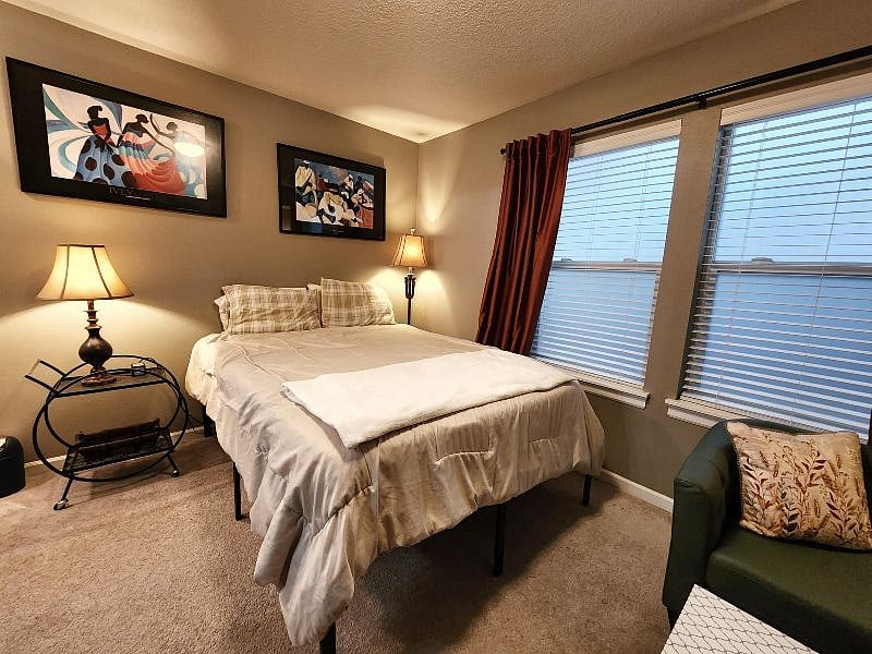 Queen sized bed with mattress topper, privacy glaze on windows and blackout shades