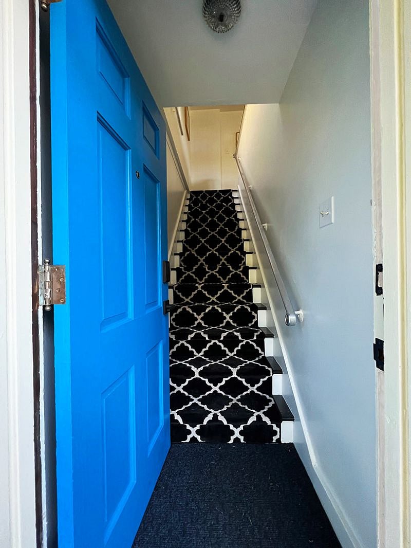 2023 newly carpeted, wide stairs with railing.