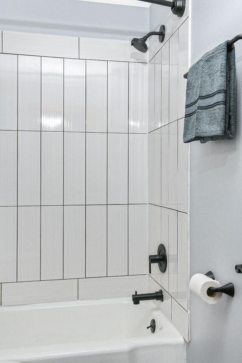 Freshly updated and modern bathroom with new tile, vanity and fixtures