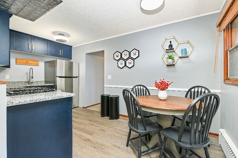 Open concept living room, dining area and kitchen that is open to hallway down to 2 bedrooms and bathroom