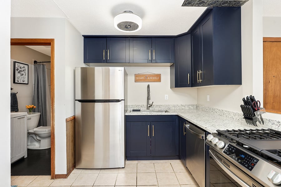 Brand new kitchen with stainless steel appliances, microwave, gas range, dishwasher