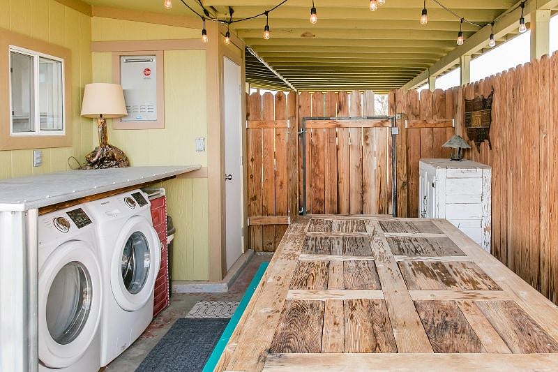 Washer and Dryer are outside under a covered Patio