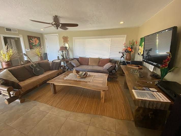 living room with black bamboo daybed and sofa.