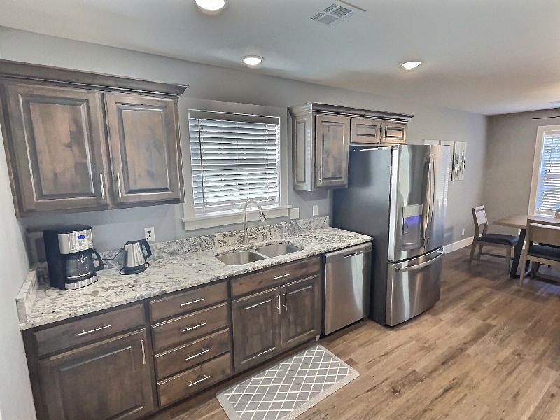 Large double door refrigerator with water dispenser and ice maker.