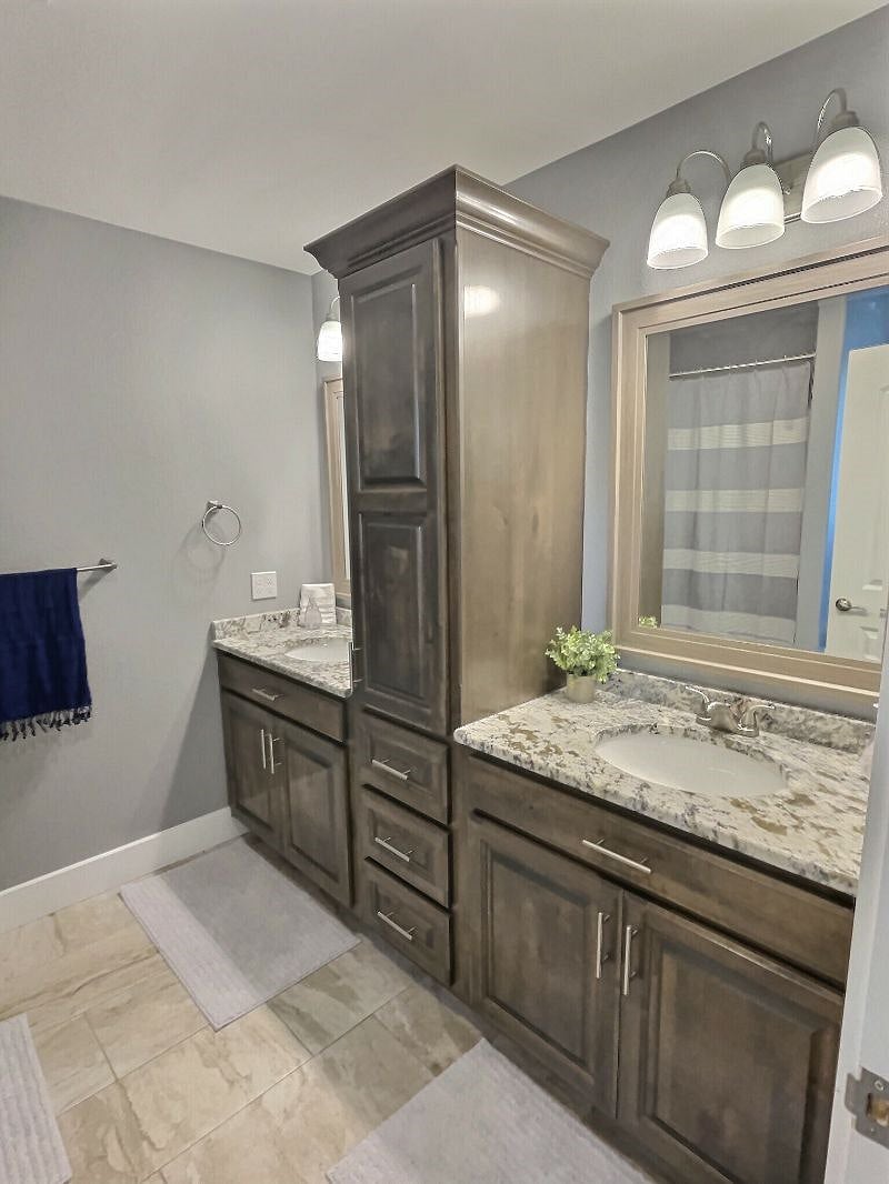 Get ready for your day in your large main bathroom with double granite top vanities, tons of storage space and spacious shower/tub.