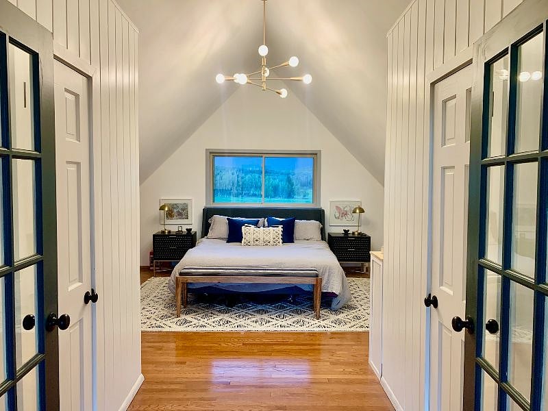 Primary bedroom - open and large, king bed, half-bath, fireplace