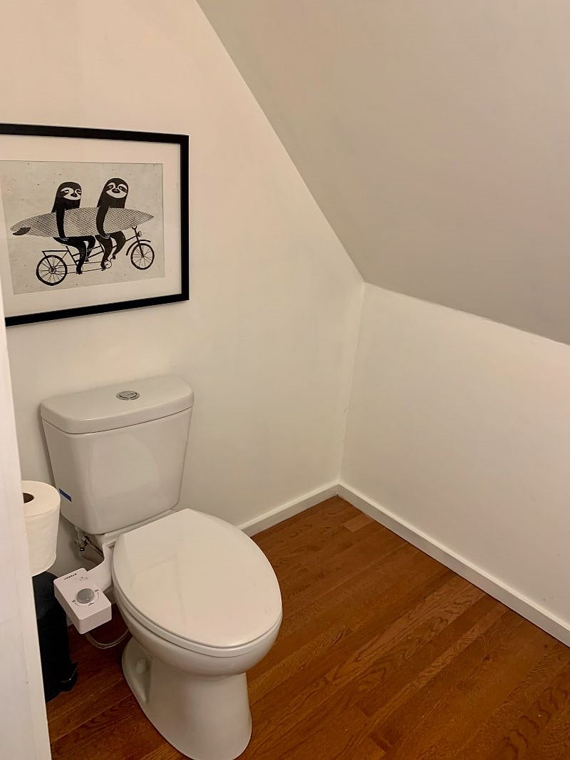 Half-bath with ample storage in primary bedroom