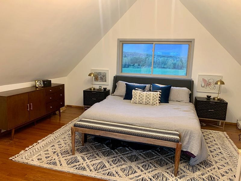 Primary bedroom Primary bedroom - open and large, king bed, half-bath, fireplace