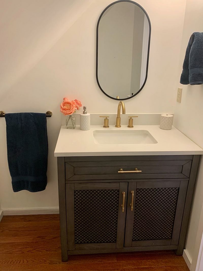 Half-bath with ample storage in primary bedroom