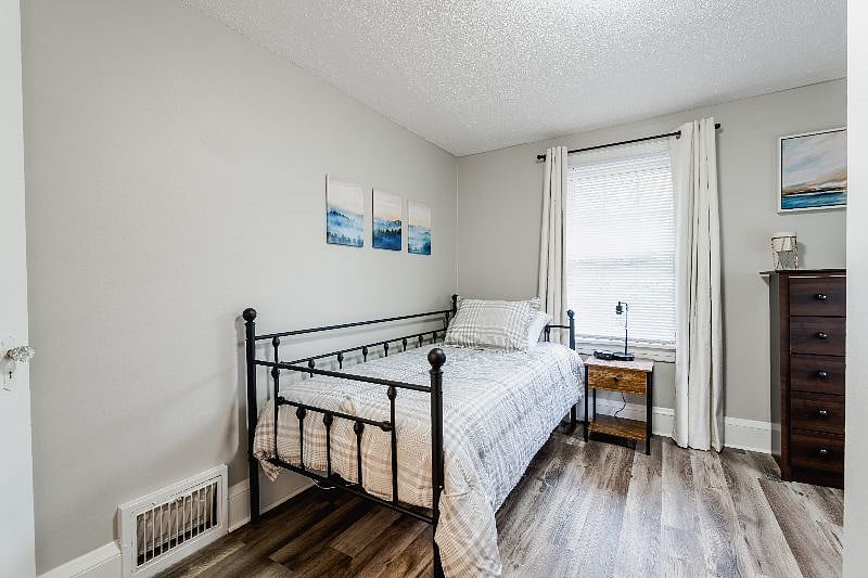 3rd bedroom with trundle bed, dresser, closet, night stand