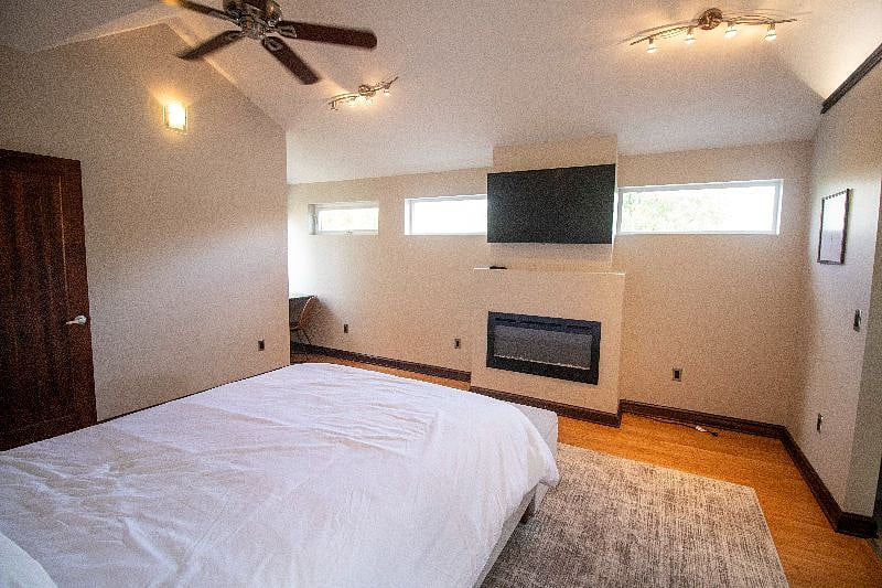 Master Bedroom with TV and fireplace