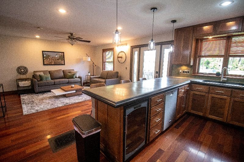 Kitchen with dishwasher, breakfast bar, wine fridge