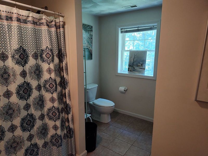 The bathroom on the floor adjacent to the room