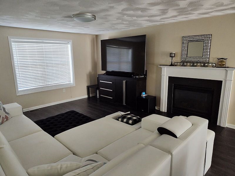 Living area with TV, sound system, fireplace, etc. View from the kitchen area