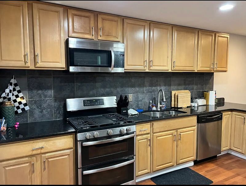 Brand new double oven and stove with a built in microwave and coffee maker.