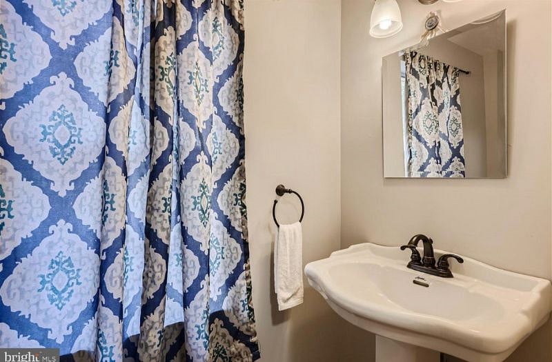 1/2 bath downstairs, in addition to the full bathrooms upstairs.