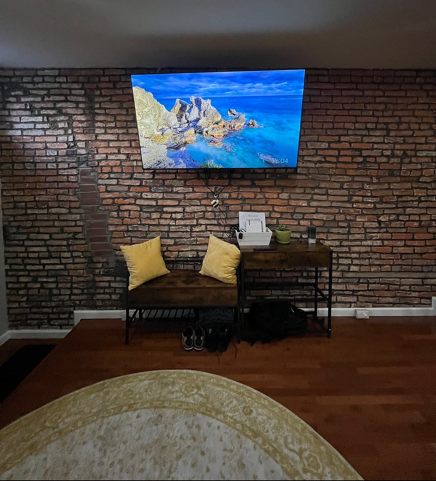 A brand new 65" screen tv with a fire stick, plus charging stations for the side tables and storage underneath the bench.
