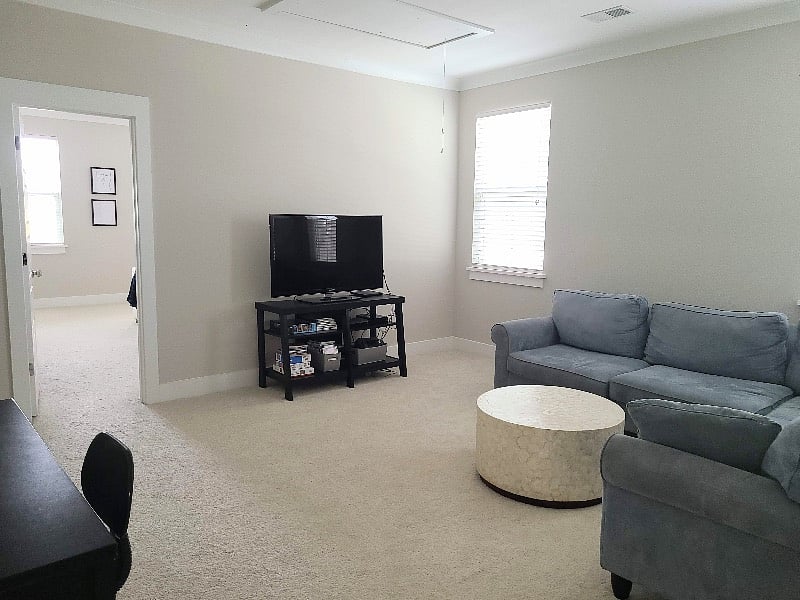 Upstairs large second living area with huge sectional,TV stand and desk. This room separates the master bedroom from the other two bedrooms