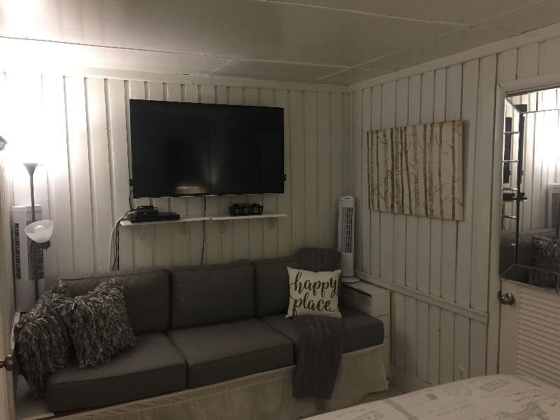Master bedroom, couch & Smart TV Walk-in closet