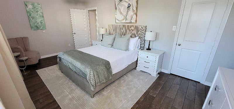 Downstairs bedroom closet with luggage rack.
