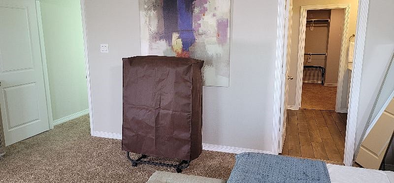Space for roll away bed in primary bedroom.