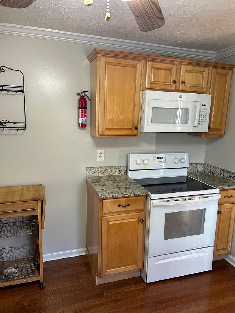 Spacious kitchen with granite countertops, fully equipped and more than adequate cabinet space.